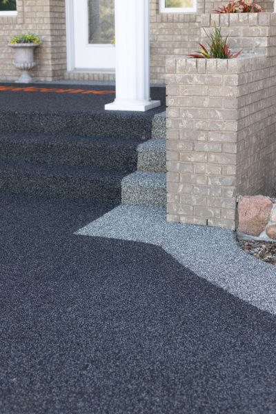 Rubber paved steps going to the front door of a house